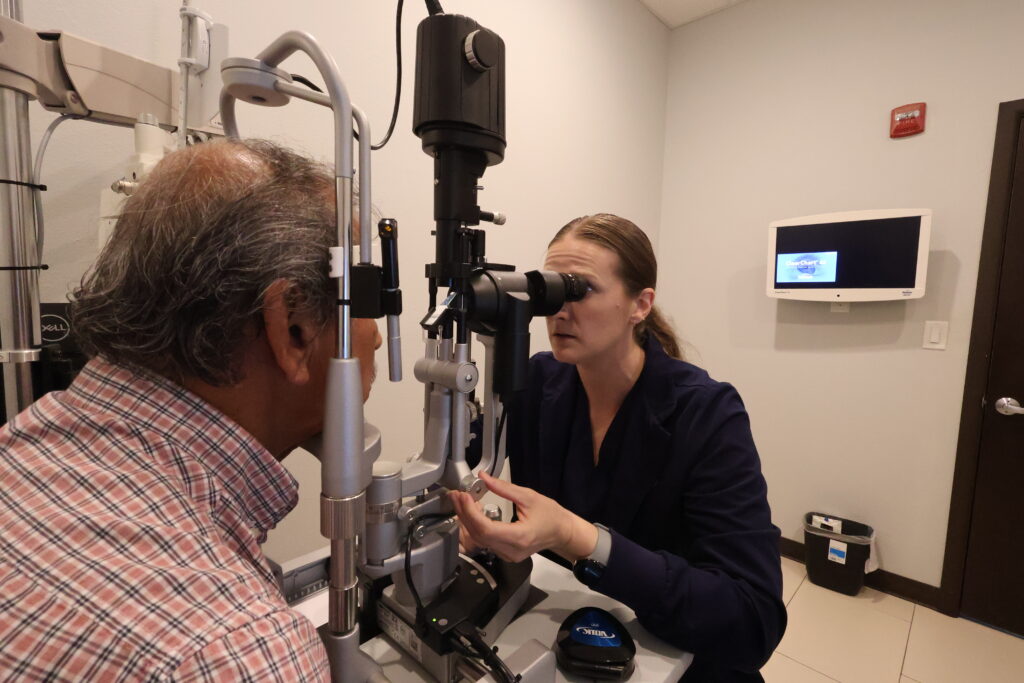 Erin Lewis, MSN, APRN, FNP-C, Nurse Practitioner at Physicians Eye Clinic of Laredo, performing an eye exam on a patient.