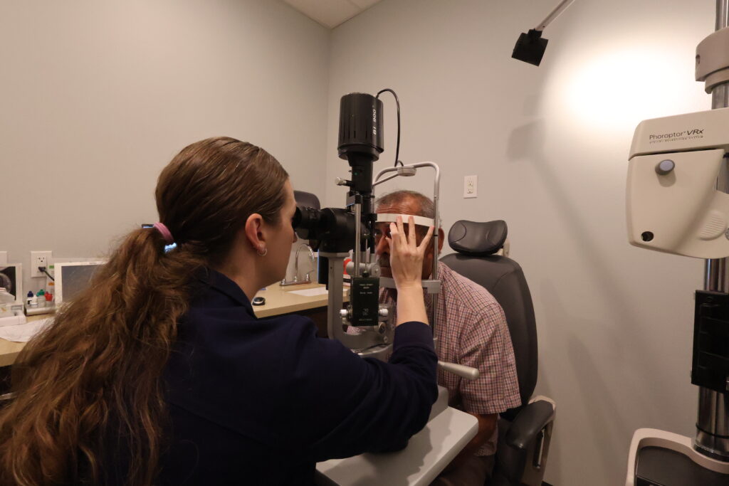 Nurse Practitioner Erin Lewis conducting an eye examination at Physicians Eye Clinic of Laredo.